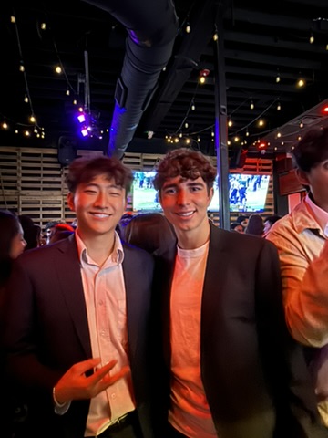 Daniel and a friend at a social gathering
